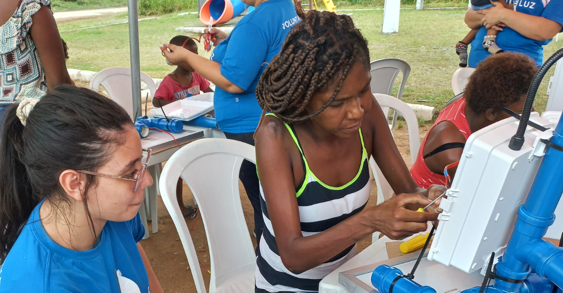 Volunteers help communities to install their own solar powered streetlights