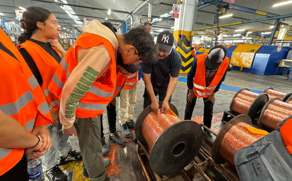 IECD students learning about the cable production process from a Nexans Morocco employee